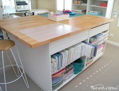 a kitchen island with lots of books on it