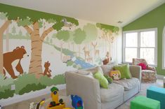 a living room filled with lots of furniture and walls painted in animal themed paint on the walls