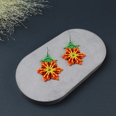 Brighten up your style with these stunning Beaded Flower Earrings! These Orange Flower Earrings are a perfect blend of elegance and charm, making them an ideal gift for your wife's birthday or a delightful surprise for Mother's Day.🎁 Handcrafted with care, these cute earrings feature intricate beaded designs that exude a unique boho vibe, perfect for anyone who loves original jewelry. Whether you're treating yourself or looking for the perfect present, these earrings are sure to bring a smile t Unique Round Bead Earrings As Gift, Unique Round Beads Earrings For Gift, Colorful Beaded Adjustable Earrings As Gift, Handmade Festive Flower Earrings, Adjustable Colorful Beaded Earrings As Gift, Adjustable Colorful Beaded Earrings For Gifts, Yellow Flower Earrings With Colorful Beads For Gift, Orange Flower Earrings With Colorful Beads For Gift, Traditional Flower-shaped Earrings With Ear Wire