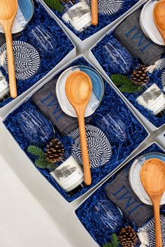 wooden spoons and plates in blue boxes with text overlay that reads cozy, inspired gift ideas custom gift design