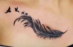 a woman's stomach with a feather and birds on it