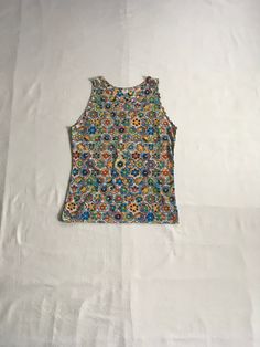 "vintage 1960s tank top Munsingwear tr-color 100% nylon multi-color op art floral abstract print good vintage condition, light wear small fabric scratch area-see photos label size XL, see below measures, lying flat, shoulder-13\" chest-21\" length29 1/2\"" Cheap Vintage Tops For Outdoor, Spring Retro Graphic Print Tank Top, Multicolor Sleeveless Top With Graphic Print, Multicolor Print Fitted Sleeveless Top, Multicolor Sleeveless Top With Vibrant Print, Fitted Multicolor Print Sleeveless Top, Fitted Sleeveless Multicolor Print Top, Patterned Retro Print Summer Tops, Summer Retro Print Patterned Tops