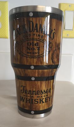 a wooden barrel sitting on top of a counter