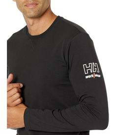 Experience the lightweight comfort of the Helly Hansen® Kensington Long Sleeve shirt, an essential piece for transition seasons!.Crewneck tee with rib-knitting at center front..Full-length sleeves featuring branding at left bicep..92% cotton, 8% elastane..Machine washable..Imported..Product measurements were taken using size MD. Please note that measurements may vary by size..Measurements: Length: 30 in Chest Measurement: 40 in Sleeve Length: 25 in Sporty Branded T-shirt For Fall, Crew Neck T-shirt With Ribbed Cuffs For Loungewear, Crew Neck Cotton T-shirt With Ribbed Cuffs, Athleisure Crew Neck T-shirt With Ribbed Cuffs, Athleisure Crew Neck Tops With Branding, Ribbed Cuffs Crew Neck T-shirt For Loungewear, Casual Long Sleeve T-shirt With Ribbed Neckline, Basic Crew Neck Tops With Ribbed Cuffs, Long Sleeve Logo Print T-shirt For Loungewear