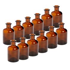 brown glass bottles are lined up in a row