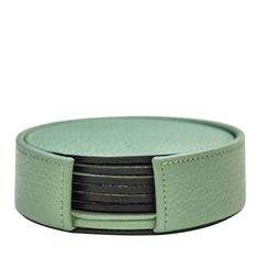 a set of four mint green leather coasters with black stripes on each one side