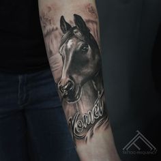 a woman's arm with a horse and the word wonder tattooed on her left arm