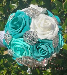 a bridal bouquet with blue and white roses