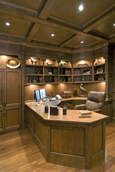 a large wooden desk sitting in front of a book shelf filled with lots of books