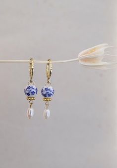 dainty blue floral porcelain huggie hoops - 18k gold plated / gold-filled hoops (Etsy) #handmadeearrings #etsyjewelry #etsyshop #etsygifts #giftforher #giftformom #earringsoftheday #earrings #earringsforwomen #earringsforwomen #aestheticearrings #huggiehoops #huggiehoop #huggieearrings #hoopswithcharm #charmhoopearrings #analuisa #mejuri #daintyjewelry #daintyearrings #charmearrings #giftforgirlfriend #hoopearrings #goldearrings #uniqueearrings #statementjewelry #statementearrings #cuteearrings Small Hoop Earrings With Charm, Handmade Small Hoop Blue Earrings, Handmade Small Blue Hoop Earrings, Artisan Blue Hoop Earrings As Gift, Handmade Blue Hoop Earrings For Gifts, Earrings Small Hoop, Porcelain Earrings, Blue Porcelain, Mini Blue