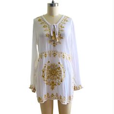 Rachel Zoe White Cotton 100% With Gold Embellishment Blouse Tunic Size Small New With Tag Chic White V-neck Embroidered Top, Elegant White Tunic With Floral Embroidery, White Embroidered Top For Summer Brunch, Elegant White Spring Tunic, Chic White Embroidered Blouse, White Long Sleeve Embroidered Top For Brunch, White Long Sleeve Beach Blouse, Chic White Embroidered V-neck Top, White Bohemian Embroidered Top For Summer