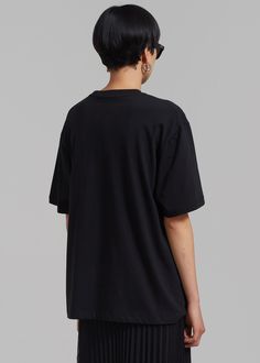 Color: Black Midweight t-shirt Boxy fit Crew neckline Drop shoulders Straight hem Unlined 100% Cotton Machine Wash Cold By The Frankie Shop. Imported Black Boxy Fit Graphic Tee, Black Oversized Basic Tops, Basic Black Oversized Tops, Black Boxy Fit Top With Graphic Print, Black Relaxed Fit Basic Top, Boxy Black Cotton Top, Casual Boxy Black Top, Black Boxy Cotton Top, Casual Black Boxy Top