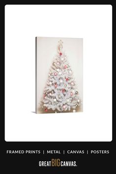 a white christmas tree with red and silver ornaments