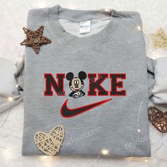 Mickey Mouse x Nike Embroidered Sweatshirt, Mickey Mouse Disney Embroidered Shirt, Nike Inspired Embroidered Shirt In the heart of fashion’s vibrant tapestry, Tinicloset stands as an iconic haven where imagination intertwines with style, inviting you to embark on a sartorial journey that’s uniquely your own. As you step through our digital doors, you’ll discover a treasure trove of custom embroidered clothing that transcends the ordinary. We’ve mastered the art of transfo Casual Mickey Mouse T-shirt For Fall, Casual Cotton Mickey Mouse Sweatshirt, Nike Embroidered Sweatshirt, Nike Inspired, Childhood Nostalgia, Shirt Nike, Embroidered Clothes, Embroidered Sweatshirt, Embroidered Sweatshirts