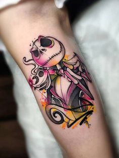 a person with a tattoo on their arm and the image of a skeleton riding a scooter