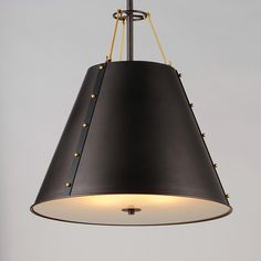 a black and gold pendant light hanging from a ceiling