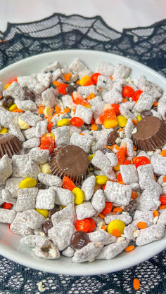 a white plate topped with candy and candies