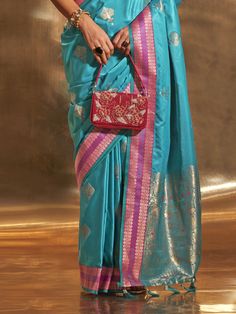 Elevate your style with our stunning sky-blue zari weaving satin function wear saree with blouse. This gorgeous ensemble is perfect for weddings, festivals, and other special occasions. The sky-blue color of the saree is truly mesmerizing and is complemented by the intricate zari weaving work, adding a touch of elegance and sophistication.
Crafted from high-quality satin material, the saree drapes beautifully and offers a comfortable fit. The matching silk blouse also features exquisite zari wea Elegant Blue Pre-draped Saree For Puja, Bollywood Turquoise Saree With Unstitched Blouse, Turquoise Saree With Unstitched Blouse, Turquoise Saree With Unstitched Blouse For Festive Occasions, Festive Turquoise Saree With Unstitched Blouse, Turquoise Semi-stitched Bollywood Saree, Turquoise Blouse Piece With Pallu For Festivals, Turquoise Silk Saree For Festivals, Bollywood Style Turquoise Silk Saree