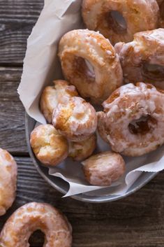 a bunch of doughnuts that are in a bowl