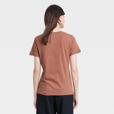 Refresh your everyday top collection with this Short-Sleeve Casual T-Shirt from A New Day™. This short-sleeve T-shirt in a solid color allows for easy pairing with a range of looks. Fashioned in a regular fit, it features a basic casual crewneck. The soft and breathable fabric offers cool comfort, while the pullover design provides ease of wear. You can coordinate it with different bottoms and match with layering pieces to create a range of outfits. A New Day™: Style that goes wherever you do. Everyday Plain Short Sleeve Top, Brown Short Sleeve Top, Brown Graphic Tee Tops For Everyday, Brown Short Sleeve T-shirt For Spring, Basic Brown Short Sleeve Shirt, Basic Brown Short Sleeve Tops, Casual Plain Brown T-shirt, Cute Brown Short Sleeve T-shirt, Coffee Color Relaxed Fit Short Sleeve T-shirt