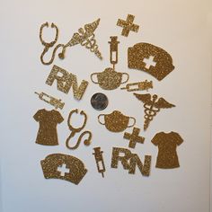 gold glittered medical symbols are arranged in the shape of letters and numbers on a white surface