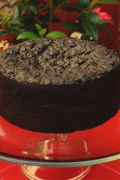 a chocolate cake sitting on top of a red plate