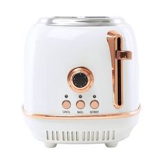 a white toaster with gold trimmings on the front and bottom, sitting on a white surface