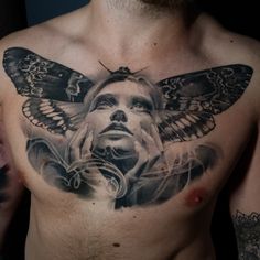 a man with a butterfly tattoo on his chest