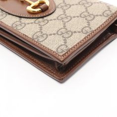 Condition AB Luxury Bifold Wallet With Gold-tone Hardware, Classic Bifold Wallet With Gold-tone Hardware, Classic Rectangular Wallet With Gold-tone Hardware, Classic Rectangular Wallets With Gold-tone Hardware, Brown Formal Wallet With Gold-tone Hardware, Formal Brown Wallet With Gold-tone Hardware, Formal Brown Wallets With Gold-tone Hardware, Classic Wallet On Chain With Gold-tone Hardware For Travel, Classic Brown Rectangular Wallet On Chain