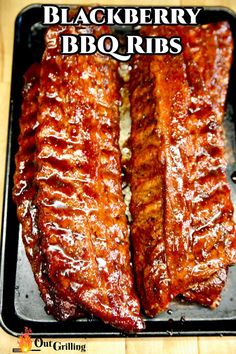 bbq ribs in barbecue sauce on a grill pan with the words blackberry bbq ribs