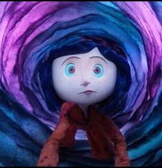 a doll with blue eyes sitting in front of a purple tunnel