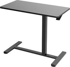 a computer desk with a black top and metal legs on an isolated white background,