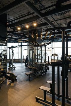 an empty gym with lots of exercise equipment