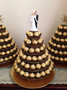 a wedding cake made out of chocolates with a bride and groom figurine on top