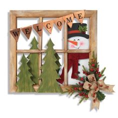 a snowman is sitting in front of a window with christmas decorations on the windowsill