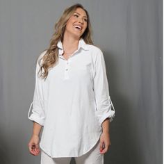 The ANTAY Tunic Top is constructed of 100% woven organic Cotton.  Harvested in Peru Showcase your unparalleled chic style in this edgy top. Daybreak Tunic Top.   The ANTAY Tunic features a Convertible long sleeves with roll-tab feature.Relaxed silhouette . Collared pointed Neck. soft Shirttail hemline. machine wash, iron as desire. White color is brightened with peroxide  Measurements are taken by Inches. Based in a loose fit. Oversize style.   Approx. Long Length 35 SBust 34 - Hips 36    MBust Spring Linen Tops With Roll-up Sleeves, White Top With Roll-up Sleeves For Fall, White Tops With Roll-up Sleeves For Fall, Versatile Tops With Shirttail Hem For Daywear, Cotton Top With Roll-up Sleeves For Daywear, Relaxed Fit Tops With Roll-up Sleeves For Spring, Chic Cotton Tops With Roll-up Sleeves, Versatile White Tops For Casual Gatherings, Fall Tops With Roll-up Sleeves For Daywear