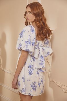 Whether you're sipping tea or rehearsing for the big day, this dress is your go-to. With oversized puff sleeves that pack a punch, they frame a square neckline and a fitted bodice with princess seams. Just below, a flared mini skirt creates a balanced feel, while the back features smocking with a large tie design. Take the look from casual to dressy and swap out the shoes. Pair it with your favorite jewelry for a completed fun look.- Oversized sleeves- Smocked back- Tie back detail- Poplin- Colo Sipping Tea, Babydoll Mini Dress, Flared Mini Skirt, Blue Floral Pattern, Babydoll Style, Church Dresses, Tie Design, Style And Grace, Cream Dress