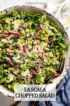 a salad with lettuce, beans and ham in a bowl