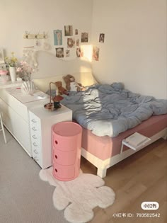 a bedroom with a bed, dresser and other items on the floor in front of it