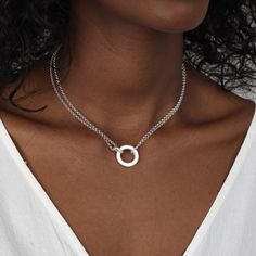 The circle is a unique symbol with a significant meaning, it represents wholeness, eternity, and timelessness, it symbolizes eternal love and endless friendship. There's no limit on how you can interpret it. This double-layer necklace will become not only a suitable choice for everyday wear but also a bold statement when layered with other unexpected combinations. Nickel-free White Gold Circular Jewelry, Silver Open Circle Necklaces For Anniversary, Anniversary Silver Open Circle Necklaces, Sterling Silver Full Circle Necklace For Anniversary, Silver Circle Jewelry With Polished Finish, Silver Circular Jewelry With Polished Finish, White Gold Sterling Silver Open Circle Jewelry, Silver Open Circle Jewelry For Anniversary, Modern Sterling Silver Infinity Necklace