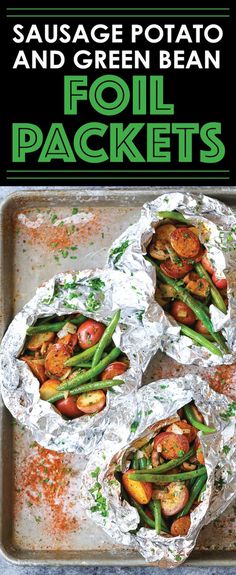 four foil packets filled with food on top of a baking sheet, and the title says sausage potato and green bean foil packets