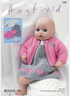 an image of a baby doll wearing a pink cardigan and grey knitted dress