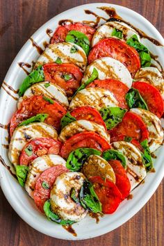 grilled tomatoes and mozzarella on a white platter