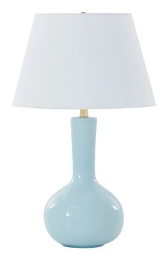 a light blue table lamp with a white shade