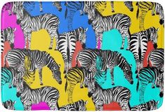 colorful zebras and giraffes on multicolored background bath mat with zipper closure