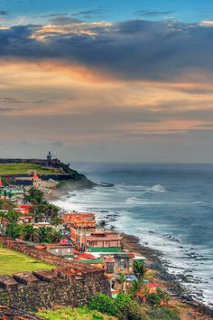 a scenic view of the ocean and city