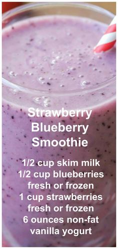 blueberry smoothie recipe in a glass with a red and white striped straw