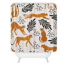 a shower curtain with cheetah and leopards on it