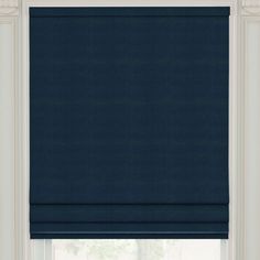 a blue roman blind in front of a window