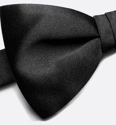 The black bow tie is crafted in silk satin and features an adjustable strap for an ideal neck fit. The pre-knotted straight edge bow tie lends an original and sophisticated touch to evening wear.. Pre-tied Satin Bow For Black Tie Events, Black Silk Tuxedo For Evening, Black Silk Tuxedo For Evening Events, Black Silk Tuxedo For Party, Tuxedo Bow For Black-tie Events, Silk Party Ties, Fitted Tuxedo Bow Tie For Evening, Elegant Black Tuxedo For Black Tie, Elegant Black Suit And Tie Accessories For Evening